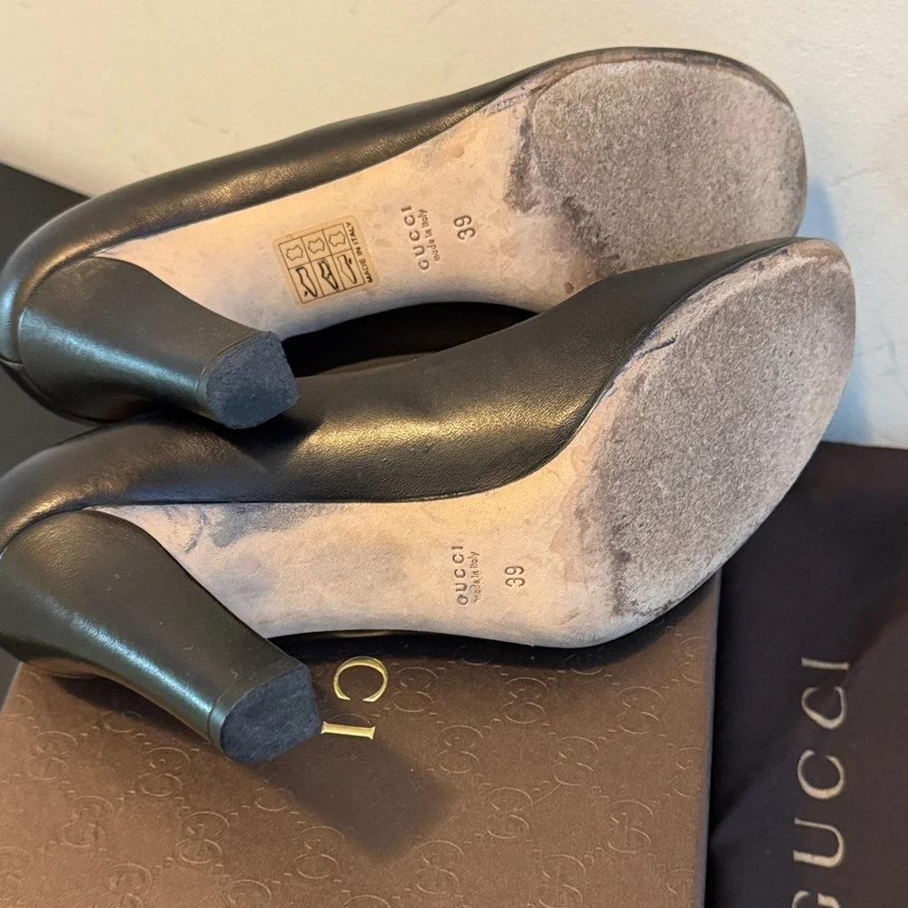 Gucci Black Heels with Iconic Gucci Gold Emblem